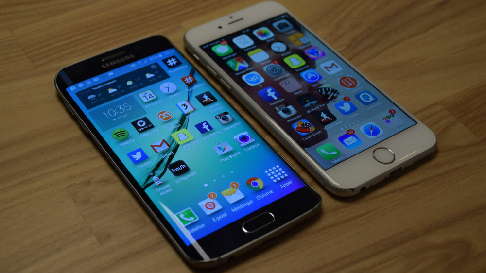 Galaxy S6 Edge og iPhone 6 er omtrent like store - og direkte konkurrenter. Galaxy S6 Edge og iPhone 6 er omtrent like store - og direkte konkurrenter.